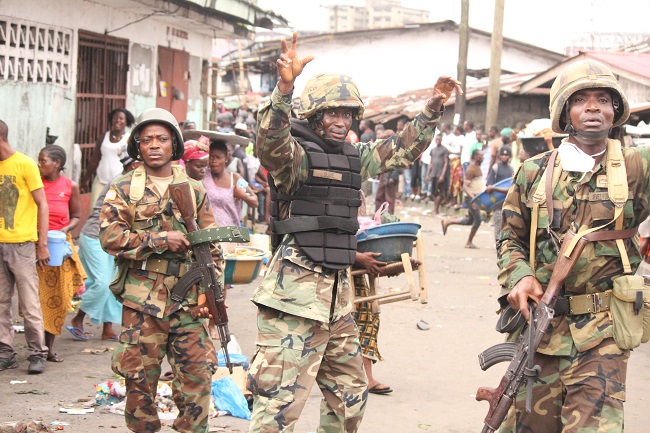 Liberian government soldiers in slum communtiy of West Point