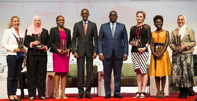 Presidents Kagame and Sall with the NEF female fellows