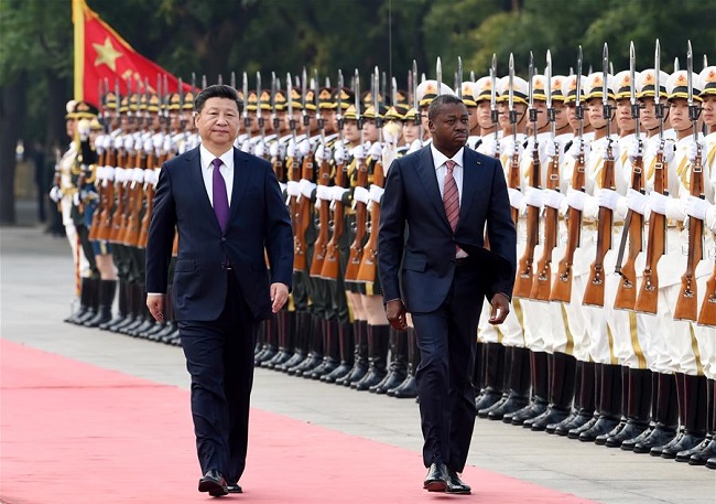 Chinese President Xi Jinping (L) welcomes  Togolese President Faure Gnassingbe before their talks in Beijing, capital of China, May 30 (Xinhua/Rao Aimin)