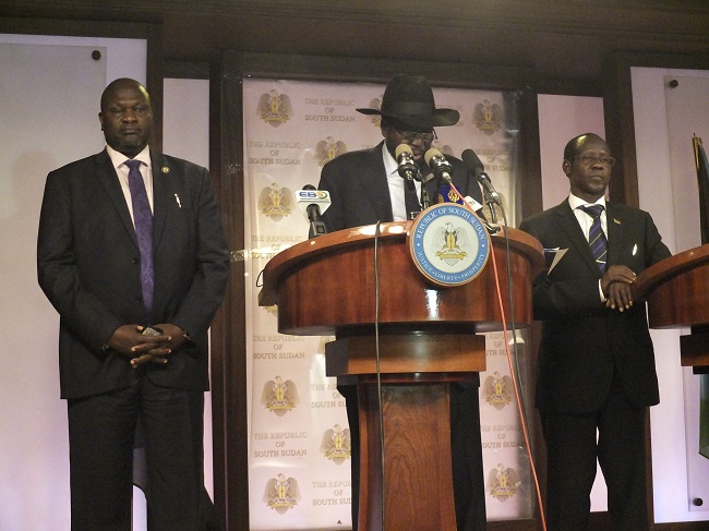 South Sudan President Salva Kiir (in hat) with Vice President Riek Machar (left) and Vice President James Wani Igga at a press conferenceas fighting broke out on 8 July. Photo: Samir Bol
